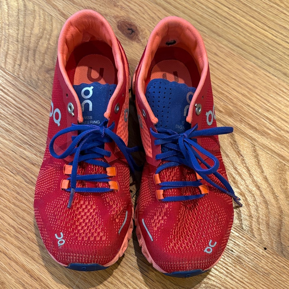 On Running Red and Blue Athletic Shoes
